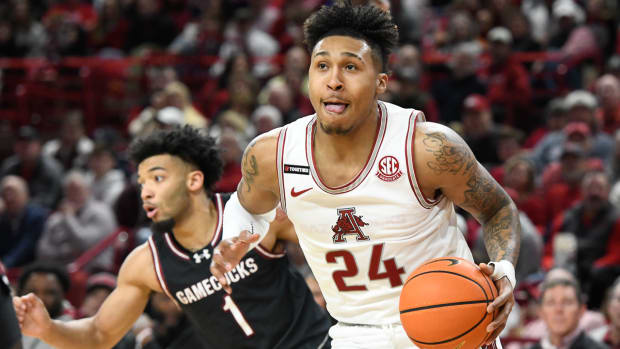 Jeremiah Davenport tries to push the ball up the floor in a loss to South Carolina in Bud Walton Arena.